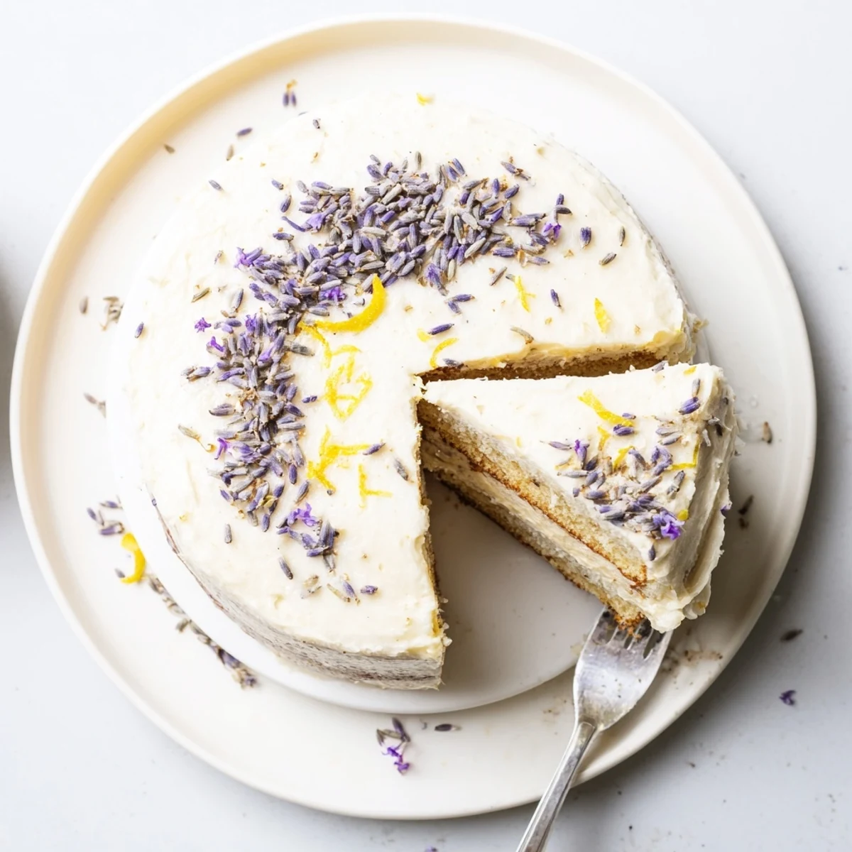 Dried lavender buds and lemon zest garnish the top of this London Fog Cake recipe dessert.