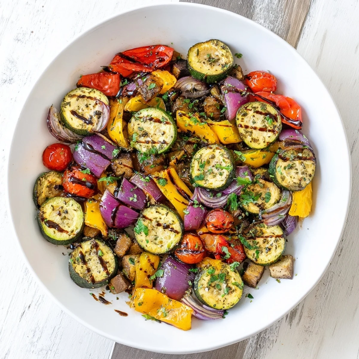 Garlic-scented Italian Roasted Vegetables sizzling from the oven, with tender eggplant cubes and bright cherry tomatoes glistening with olive oil.