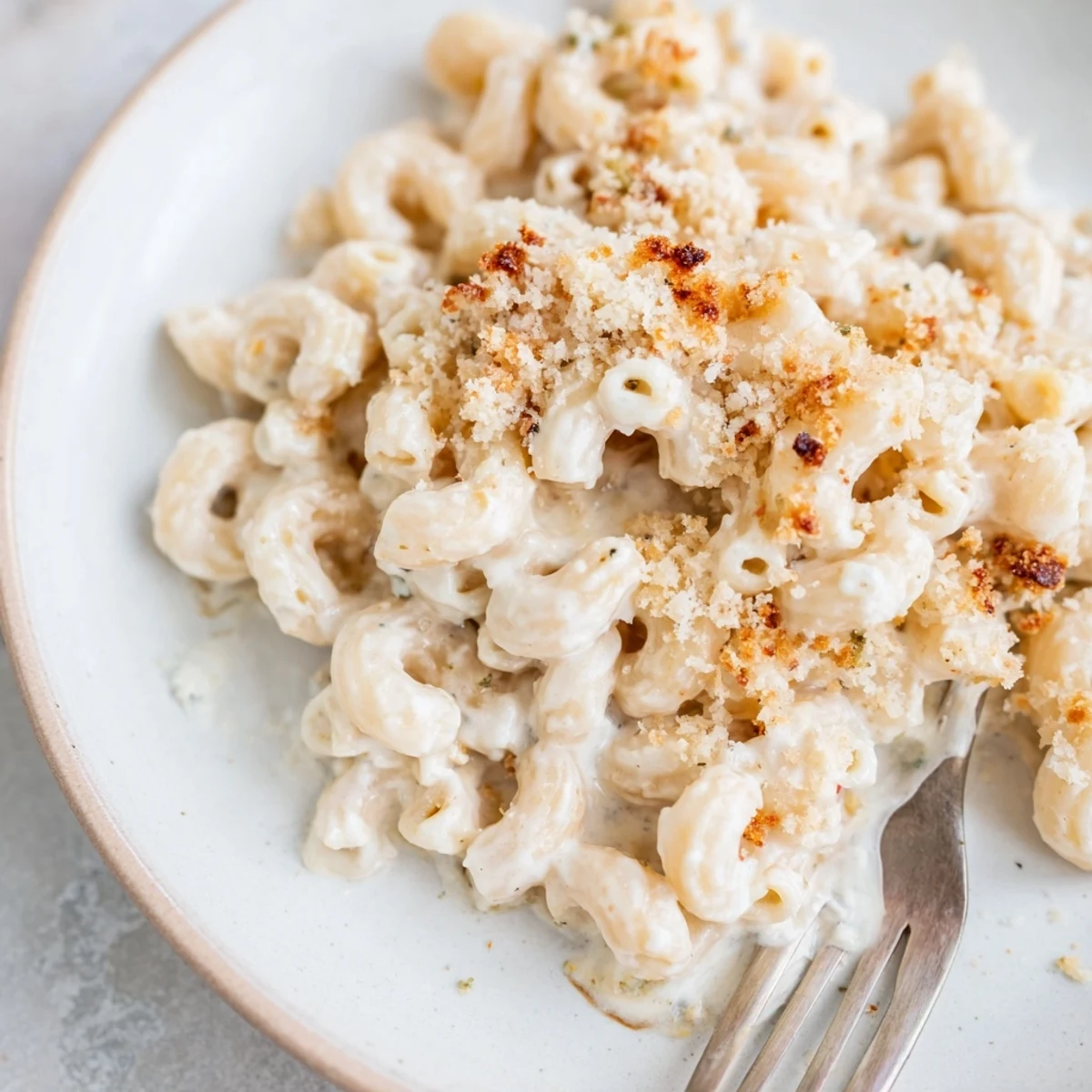 Baked Boursin mac and cheese bubbling hot with melted cheddar and crispy Parmesan panko crust