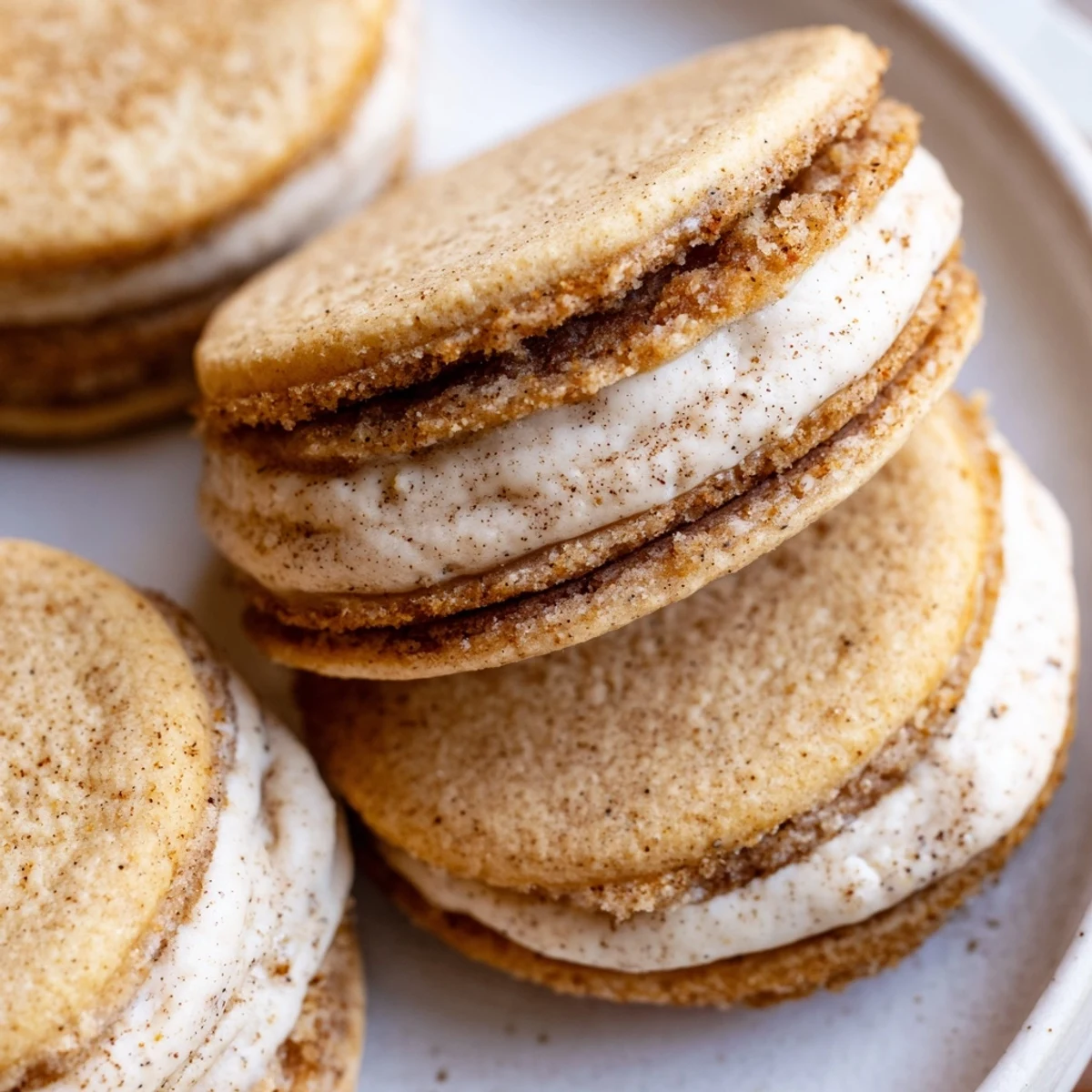 Delicate chai spiced shortbread cookies sandwiched with creamy frosting perfect for afternoon tea time