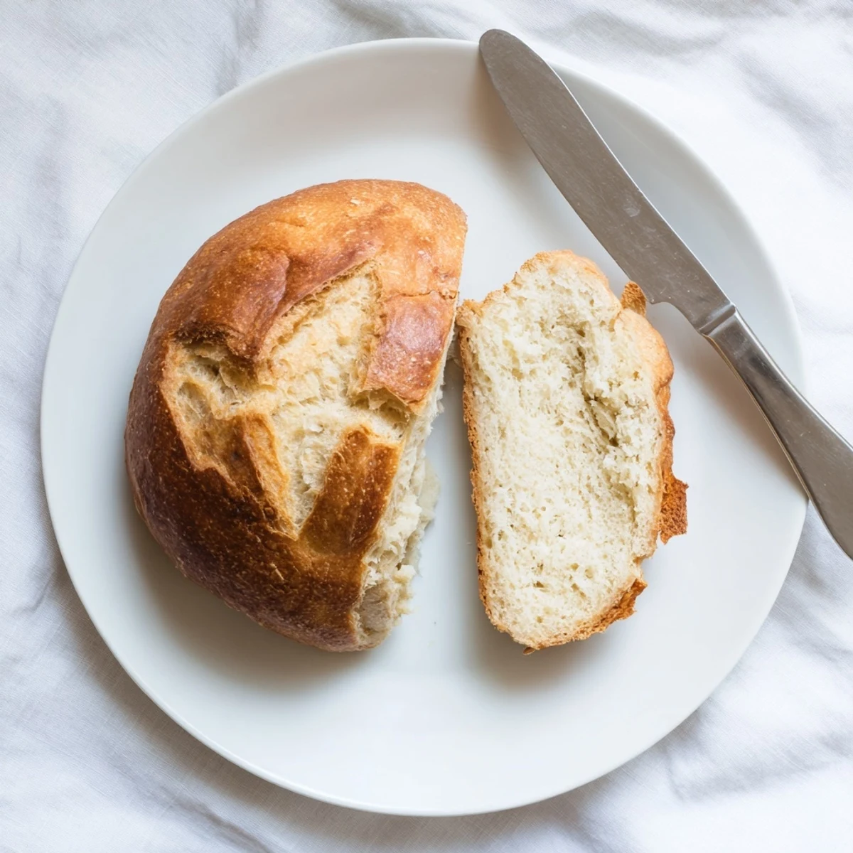 No-oven stovetop bread cooked in a covered skillet showing crispy golden crust on both sides