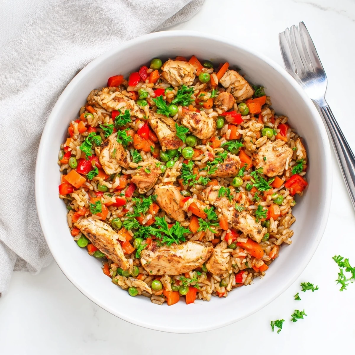 Golden brown spiced chicken thighs nestled over fluffy yellow rice with colorful vegetables in one pot shawarma chicken and rice