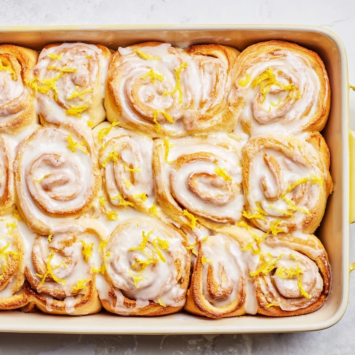 Soft lemon rolls sliced open revealing sweet lemon sugar filling and fluffy textured dough