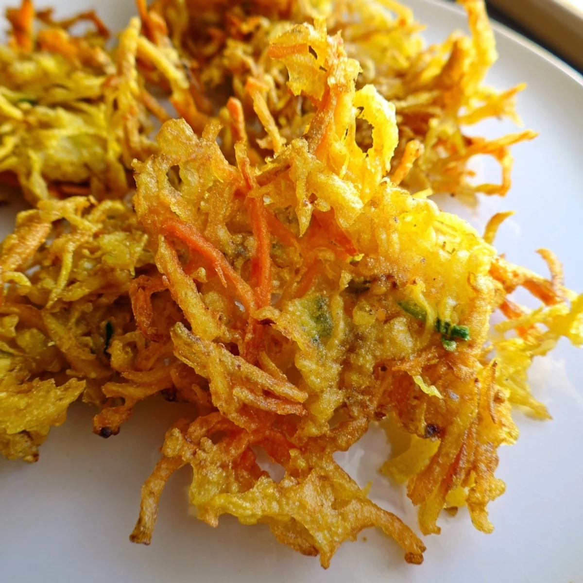 Golden crispy Ukoy Filipino shrimp fritters served with vinegar garlic dipping sauce