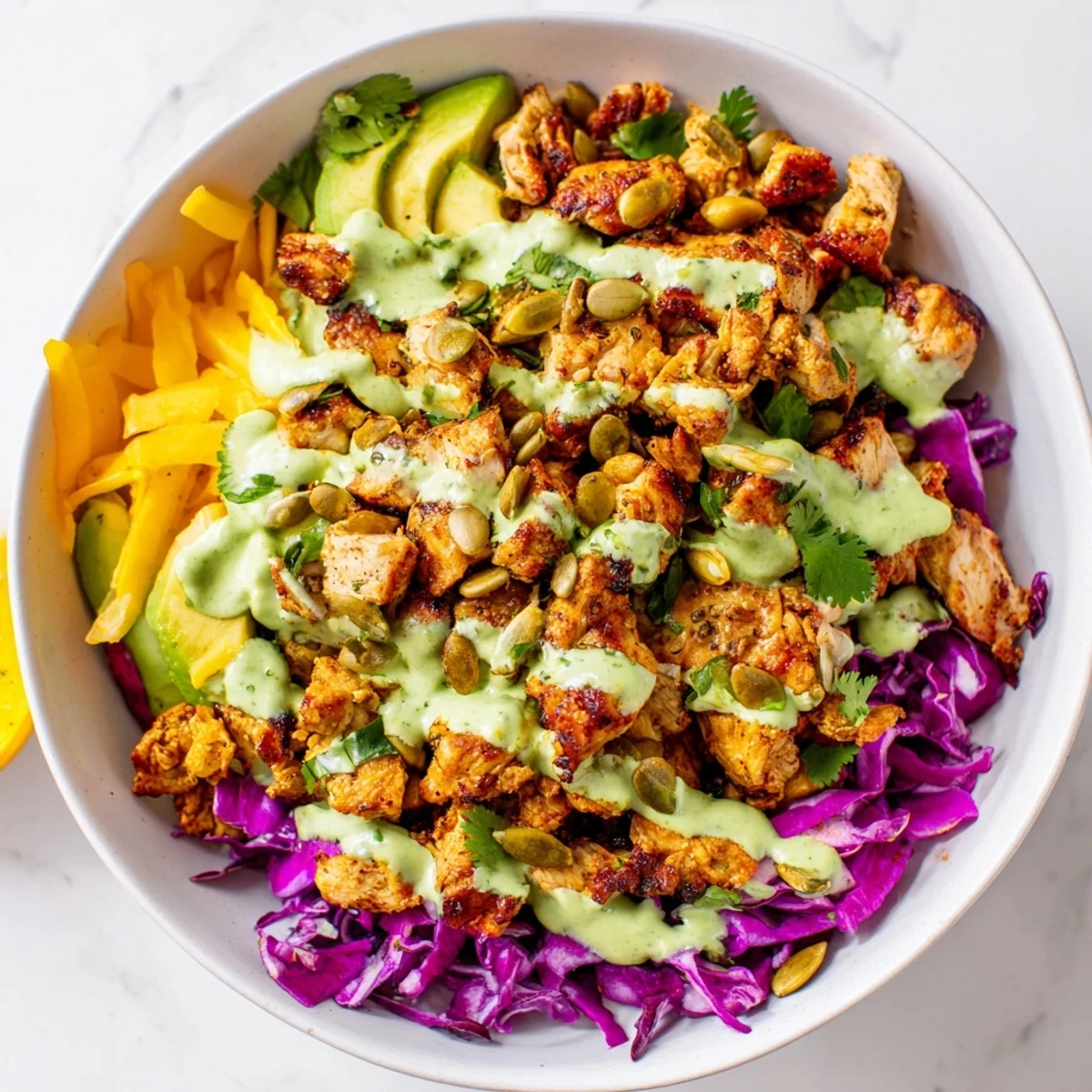 Keto bowls featuring crisp romaine, bell peppers, and tender spiced chicken drizzled with dressing