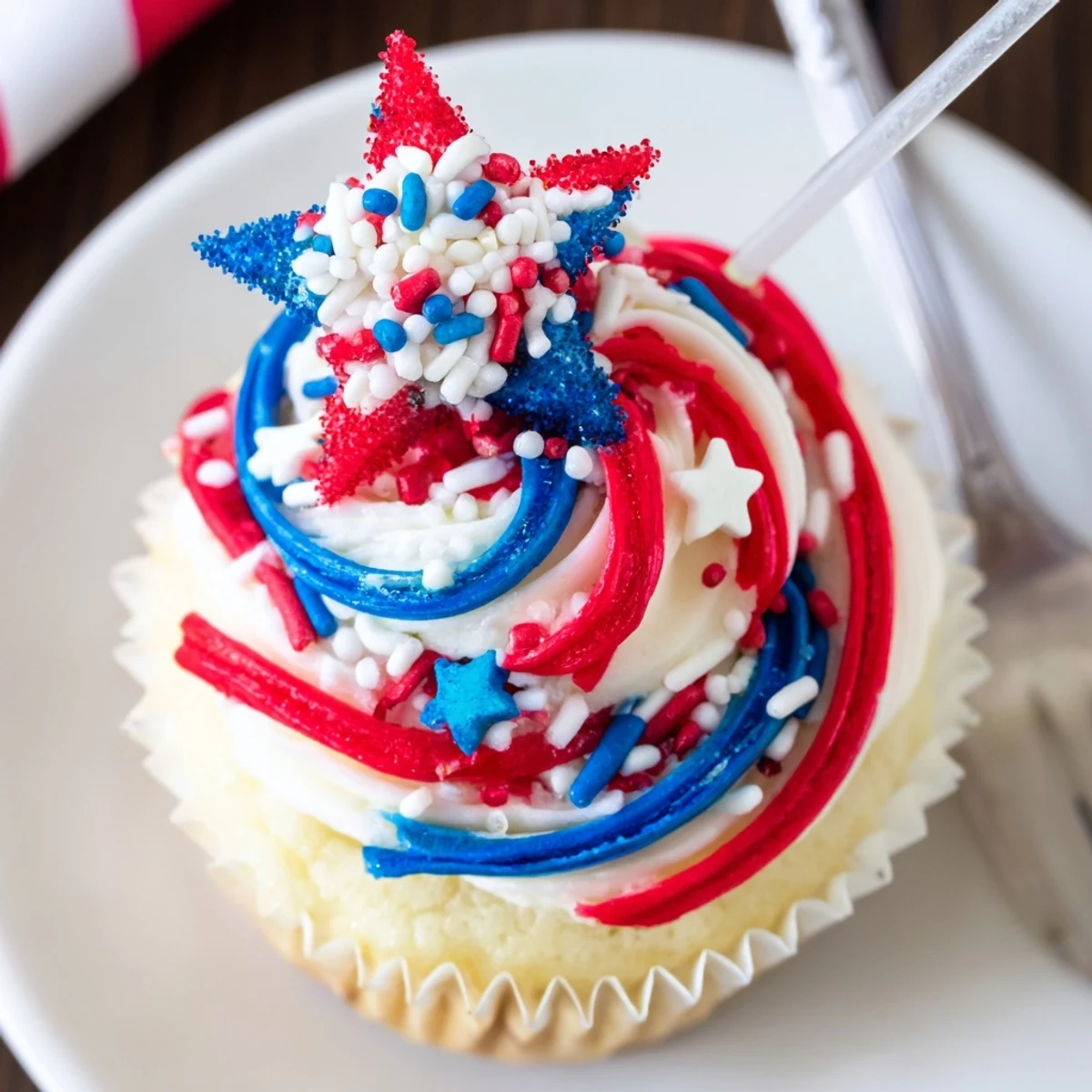 Close-up of Patriotic Firework Cupcakes with tall swirls, ready for picnic.